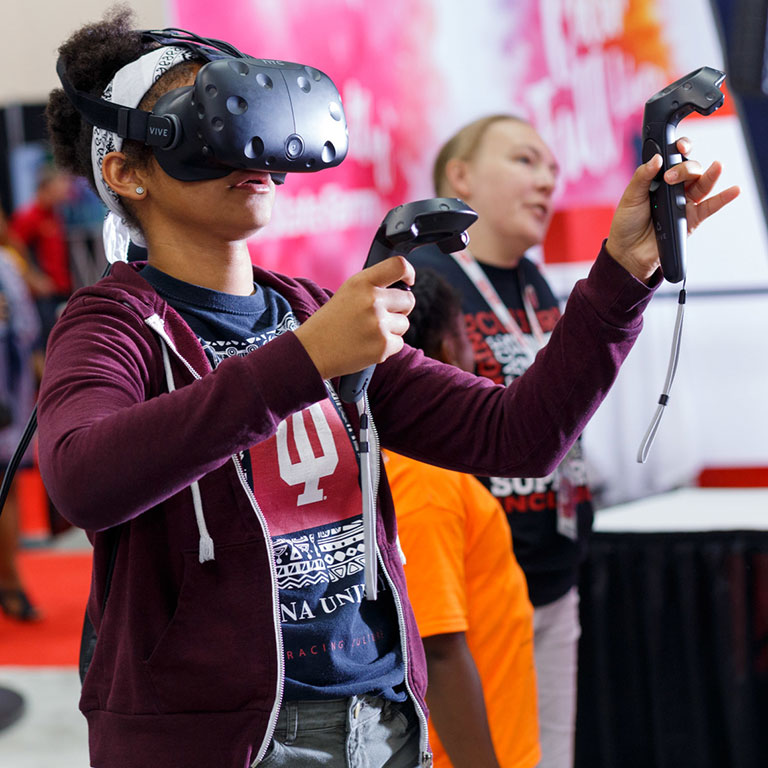 A student plays a virtual reality game at Indiana Black Expo